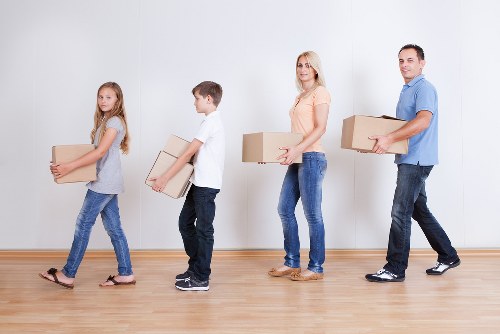 Packed boxes and labelled items ready for apartment moving day