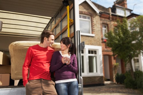 Professional movers handling boxes in Palmers Green